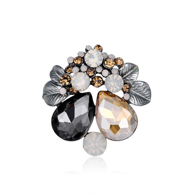 Front product view of the flower brooch pin in silver and gold