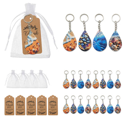 White sheer bags, thank-you tags, and four ocean-print teardrop keychains are displayed in groups.