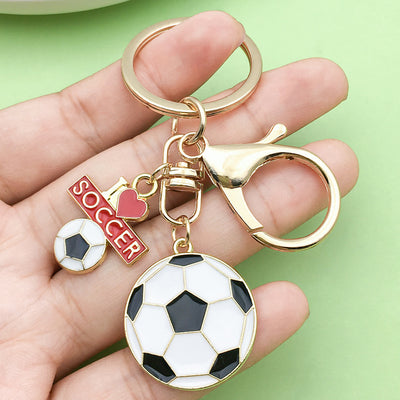 Image 1 showing a hand holding two key chains.
