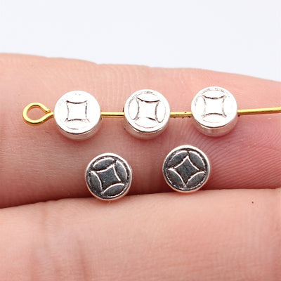 Antique Gold, Antique Silver double sided geometric coin beads in two finishes shown in front view