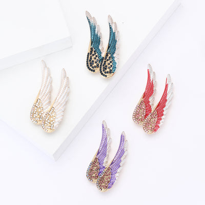 Front view of a swept angel wing edged with rows of clear crystals