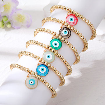 Gold Tone Bead Stretch Bracelets with Round Evil Eye Charms