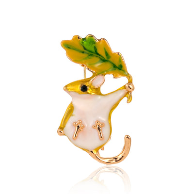 Front product view of the leaf brooch pin in gold and yellow