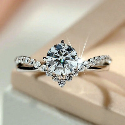 Silver crown clear round center ring on soft beige surface