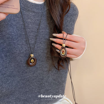 Brown Oval Layered Pendant Necklace On Black Cord Pendant Jewelry