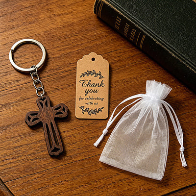 Packaging overview shows the dark wood open-cross keychain with an organza bag and kraft tags.