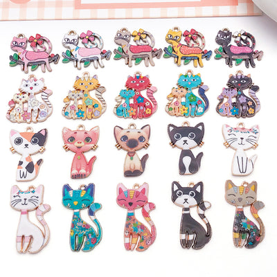 Colorful cat charms arranged on a light background