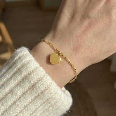 On-wrist view of puffed heart link bracelets in main image 1.