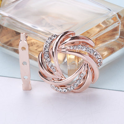 Front view of the rose gold tone twisted metal knot circle brooch pin brooch and its color options