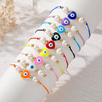 Cord and Pearl Accent Heart Evil Eye Bracelets in Nine Colors