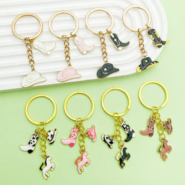 Western Cowboy Charm Keychains Featuring Black Boot Across 30 Pictured Variations