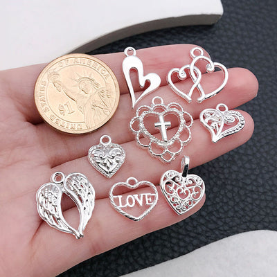 Metallic tag and heart charms shown in a close-up product view