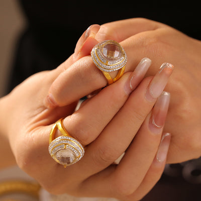 Gold oval zircon double halo rings worn on two fingers