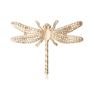 Gold openwork dragonfly brooch with cat eye stone front