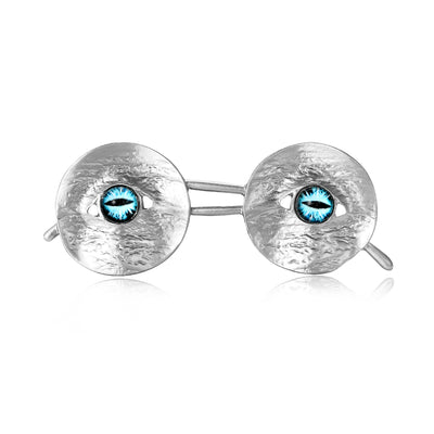The first image shows the round eyeglasses brooch from the front.