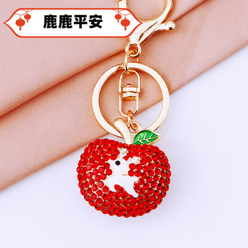 Jeweled Red Apple Keychain with White Deer Silhouette and Green Leaf