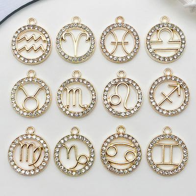 Metallic assorted shape charms arranged on a light background