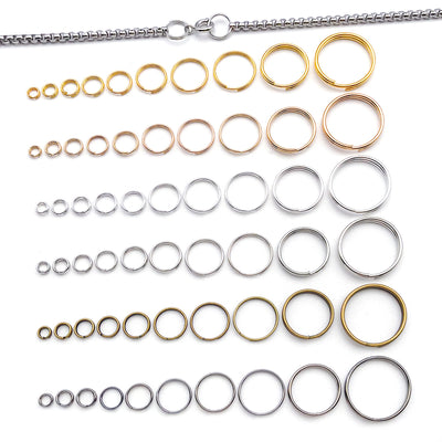 Metallic jump ring jewelry findings arranged on a light background