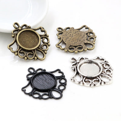 Ornate Small Round Cabochon Pendant Bases in Three Finishes shown in a grouped front view