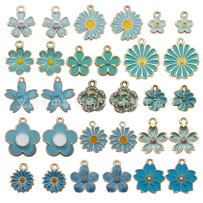 Colorful daisy charms arranged on a light background