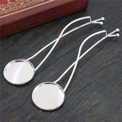 Silver Tone Round Cabochon Bezel Hair Clip Findings, grouped overview on a plain background