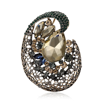 Front view of an openwork oval swirl set with large faceted stones and crystals