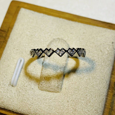 White gold heart row pavé thin ring on beige display pad