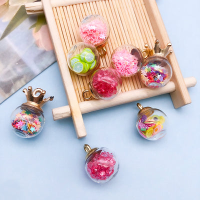 Colorful assorted shape charms arranged on a light background