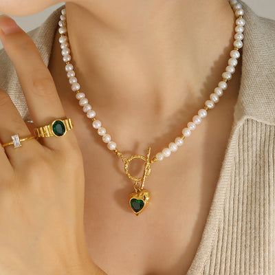 Pearl strand gold toggle green heart zircon necklace on model