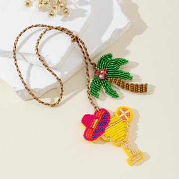Beaded Cocktail Glass And Palm Tree Pendant On Braided Cord