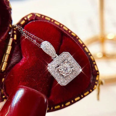 Silver square halo clear CZ pendant necklace in open red velvet box