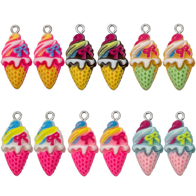 Multicolor ice cream and cake jewelry findings arranged on a light background