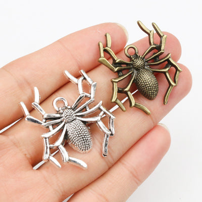 Spider connector charms showing assorted shapes and finishes