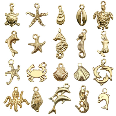 Gold-tone starfish and seahorse charms pictured with visible surface details