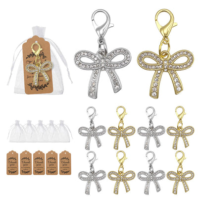 Silver and gold rhinestone bow charms with bags and tags