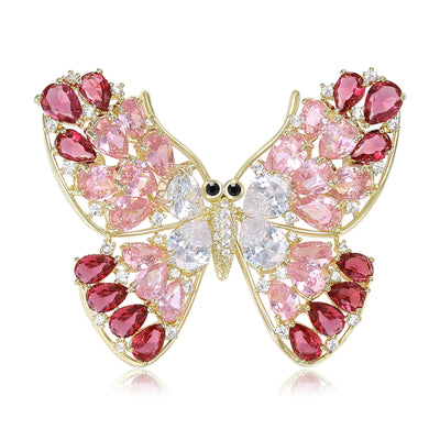 Pink red crystal gold butterfly brooch front on white