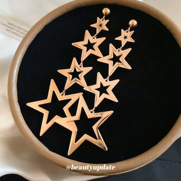 Gold Tone Open Star Long Cascade Statement Dangle Earrings