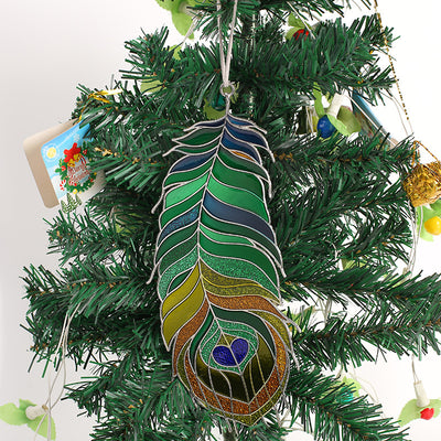 Multicolor metal peacock feather ornament hanging on Christmas tree