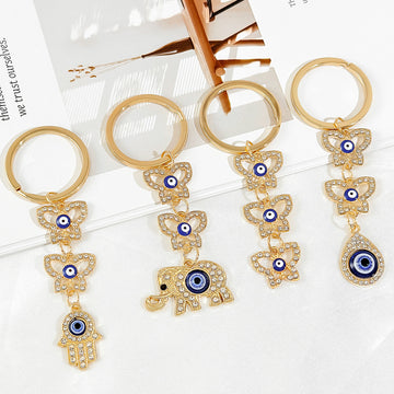 Gold Rhinestone Evil Eye Keychain With Butterfly And Hamsa Charm