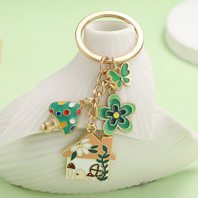 Image 1 showing a key chain with a green and white design.