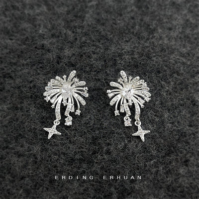 Silver CZ firework star drop studs on dark gray fabric