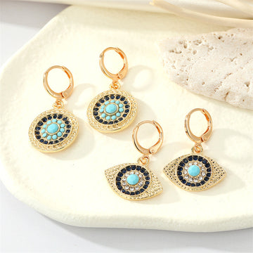 Gold Tone Crystal Turquoise Sun and Evil Eye Huggie Earrings