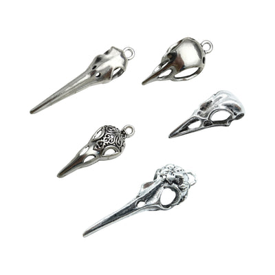 Metallic assorted shape charms arranged on a light background