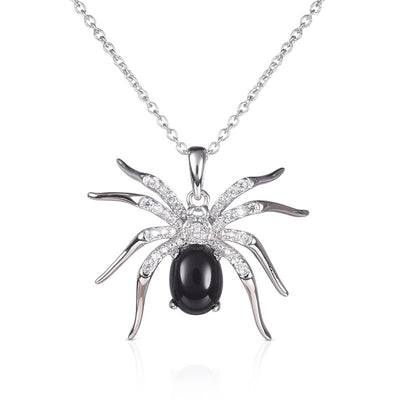 White gold spider pendant black oval body on white background