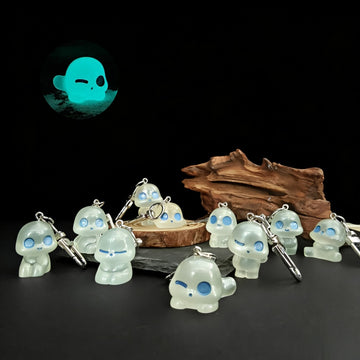 Glow-in-the-Dark Blue-Eyed Alien Figure Keychains in Ten Poses