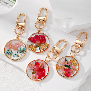 Gold Tone Round Pressed Flower and Fish Clip Keychains