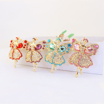 Four gold tone winged fairy figures in red, purple, blue, and pink.