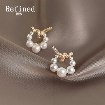 Gold Tone Clear Stone Bow And White Pearl Circle Stud Earrings