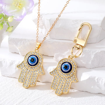 Gold and Silver Tone Crystal Hamsa Evil Eye Necklaces and Keychains