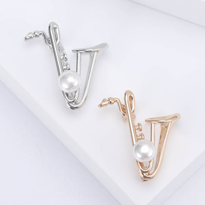 Front view of the pearl saxophone brooch and its color options